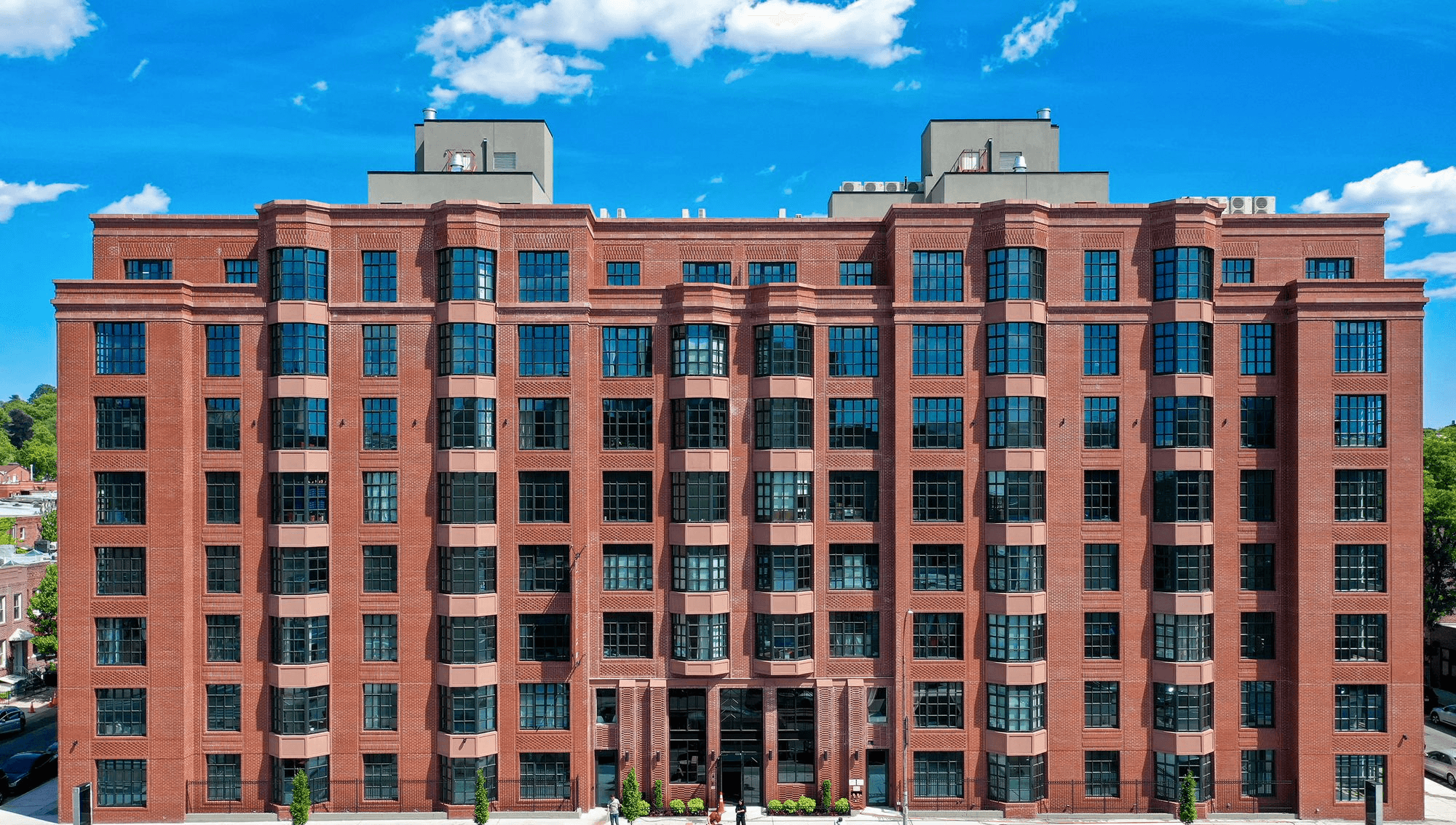 875 Fourth Avenue luxury apartments in Sunset Park Brooklyn - stunning red brick building with Manhattan skyline views